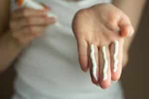Sunscreen for melanoma prevention on a person's hand